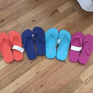 NWT various colored flip flops